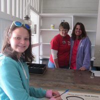 Mariah gets her postcard ready to mail. Melissa and Dana opened the Portsmouth Post Office (like Brigadoon, but we only have to wait two year instead of 100 in between visits) for special postmarks. 