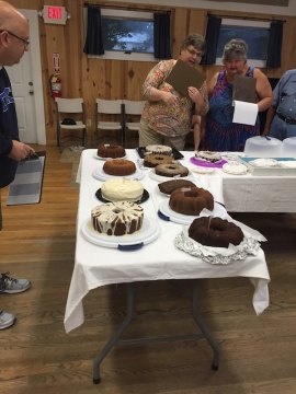 Bake-off judges Richard Bryant, Candy Gaskill, and Donna Marie Emmert check out the 11 Traditional entries.