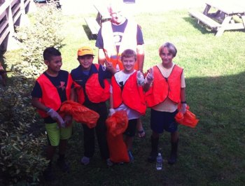 A Clean Sweep The Webelos! Left to right: Edwin Perez, Brandt O'Neal, Jackson Strange, and Julian Bennink with leader Howard Bennink.
