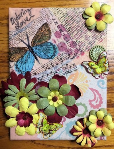 Another Successful OPS Art Show! This one came home with us! Mariah is spending her plant-watering job money on this collage by Jan Nichols McClay.