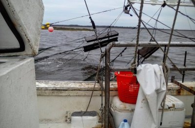 Grundens seen here after being sprayed clean for the next tow. The gear costs about as much as a suit and tie. 