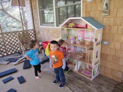 Childcare, in a Family Way Yeah, they're cool with their big dollhouse: Cora, Kyler, and Sam.